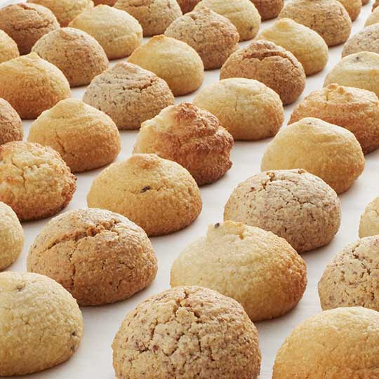 Rows of golden maple walnut, pistachio, lemon lavender, amaretti italian almond macaroons