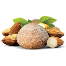 Charger l&#39;image dans la galerie, Flavour image of amaretti almond macaroon cookie with whole almonds behind cookie on white background
