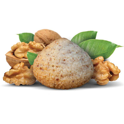 Flavour image of walnutti almond macaroon amaretti cookie with whole shelled and deshelled walnuts behind cookie on white background